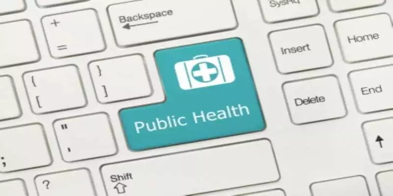 A closeup of a computer keyboard where the return bar has been relabeled "Public Health" and there is a doctor's bag icon on it.